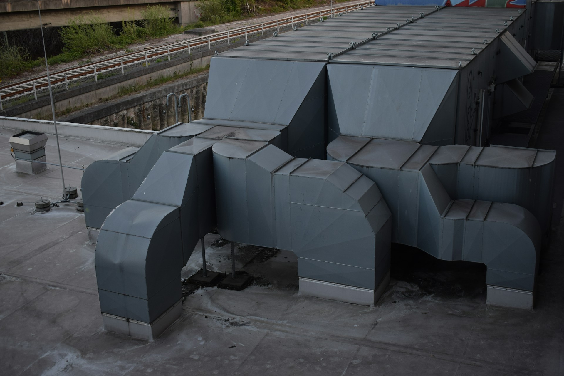 A collection of ventilation exhausts on top of a building